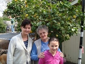 Lucyna, back right, with daughter Justyna (left), granddaughter Nadja (front) and grandson Domi on trampoline in background